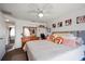 Comfortable bedroom with sliding glass door, ceiling fan and decorative pillows at 4209 Stratfield Dr, New Port Richey, FL 34652