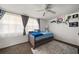 Comfortable bedroom with large window and ceiling fan at 4209 Stratfield Dr, New Port Richey, FL 34652