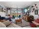 Bright living room with a large TV, comfortable seating, and view to the outside at 4209 Stratfield Dr, New Port Richey, FL 34652