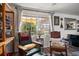 Comfortable living room featuring chairs with backyard views at 4209 Stratfield Dr, New Port Richey, FL 34652