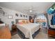 Comfortable bedroom with sliding glass door, ceiling fan and decorative pillows at 4209 Stratfield Dr, New Port Richey, FL 34652