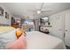 Comfortable bedroom with sliding glass door, ceiling fan and decorative pillows at 4209 Stratfield Dr, New Port Richey, FL 34652