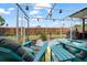 View of screened patio featuring outdoor furniture, a garden, and a fenced yard at 4209 Stratfield Dr, New Port Richey, FL 34652