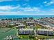 Breathtaking aerial view of a waterfront community with boat docks and stunning ocean views at 425 150Th Ave # 2501, Madeira Beach, FL 33708