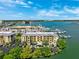 Aerial view of the building highlighting well-maintained landscaping, waterfront access, and parking at 425 150Th Ave # 2501, Madeira Beach, FL 33708