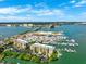 Aerial view of the community showing waterfront access, marina, and building exteriors at 425 150Th Ave # 2501, Madeira Beach, FL 33708