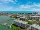 Aerial view showcasing community buildings, waterfront location, and marina access at 425 150Th Ave # 2501, Madeira Beach, FL 33708