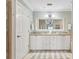 Bathroom with tile flooring, shower, soaking tub, and large vanity with double sinks at 425 150Th Ave # 2501, Madeira Beach, FL 33708