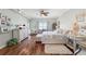 Charming bedroom boasts hardwood floors, plush rug, and a ceiling fan to stay cool at 425 150Th Ave # 2501, Madeira Beach, FL 33708