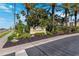 Beautiful sign for Snug Harbour Condominiums surrounded by lush, mature, tropical landscaping at 425 150Th Ave # 2501, Madeira Beach, FL 33708