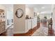 Bright hallway features hardwood floors, elegant décor, and easy access to the living and dining areas at 425 150Th Ave # 2501, Madeira Beach, FL 33708