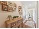Inviting hallway with wood floors, stylish décor, and easy access to a bright bedroom space at 425 150Th Ave # 2501, Madeira Beach, FL 33708