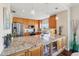 Modern kitchen with stainless steel appliances, granite countertops, and wood cabinets and stylish decor at 425 150Th Ave # 2501, Madeira Beach, FL 33708