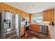 Modern kitchen featuring stainless steel appliances, granite countertops, and wood cabinets at 425 150Th Ave # 2501, Madeira Beach, FL 33708