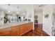 Open kitchen featuring a granite countertop and stainless steel appliances that opens into the dining area at 425 150Th Ave # 2501, Madeira Beach, FL 33708