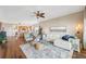Open-concept living space featuring hardwood floors, comfortable seating, and access to the kitchen at 425 150Th Ave # 2501, Madeira Beach, FL 33708