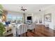 Spacious living room with hardwood flooring, comfortable seating, balcony access and beautiful ocean views at 425 150Th Ave # 2501, Madeira Beach, FL 33708