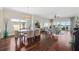 Bright living space with hardwood floors, dining area and sliding glass doors to the outdoor seating area at 425 150Th Ave # 2501, Madeira Beach, FL 33708