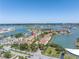 Aerial view showcasing the coastal property with stunning waterfront views and harbor access at 472 Sandy Hook Rd, Treasure Island, FL 33706