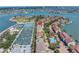 Aerial view of the community showcasing the property's location near the water, tennis courts, and pool at 472 Sandy Hook Rd, Treasure Island, FL 33706