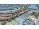 Expansive aerial view showcasing condos, tennis courts, and scenic water views at 472 Sandy Hook Rd, Treasure Island, FL 33706