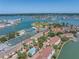 Aerial view of the community highlighting the property's location near the water, tennis, and pool at 472 Sandy Hook Rd, Treasure Island, FL 33706