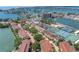 Aerial view of the community showcasing the property's proximity to the tennis courts and waterfront at 472 Sandy Hook Rd, Treasure Island, FL 33706