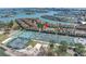 Stunning aerial view of condos near tennis courts, with a glimpse of the bay at 472 Sandy Hook Rd, Treasure Island, FL 33706