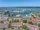 Aerial view of the community showcasing the property's location near the water and tennis courts at 472 Sandy Hook Rd, Treasure Island, FL 33706
