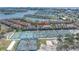 Scenic aerial shot of waterfront condos, tennis courts, and nearby bay views at 472 Sandy Hook Rd, Treasure Island, FL 33706