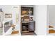 Stylish bar area with a wine fridge, liquor cabinet, granite countertop, and decorative touches at 472 Sandy Hook Rd, Treasure Island, FL 33706