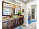 Full bathroom showing glass bowl sink, walk in shower, soaking tub, and tile floors at 472 Sandy Hook Rd, Treasure Island, FL 33706