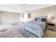 Spacious bedroom featuring tile flooring, ample lighting, and a comfortable bed setup at 472 Sandy Hook Rd, Treasure Island, FL 33706