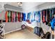 Spacious walk in closet with rows of hanging cloths, and a box at 472 Sandy Hook Rd, Treasure Island, FL 33706