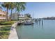 Dock with boats and waterfront condos, providing easy access to boating and scenic views at 472 Sandy Hook Rd, Treasure Island, FL 33706