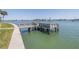 Waterfront home with a private wooden dock offering direct access to the tranquil water at 472 Sandy Hook Rd, Treasure Island, FL 33706