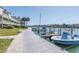 Dock featuring boats and waterfront condos, offering a relaxing waterfront atmosphere at 472 Sandy Hook Rd, Treasure Island, FL 33706