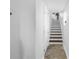 Bright entryway with staircase leading to upper levels and tile flooring at 472 Sandy Hook Rd, Treasure Island, FL 33706