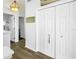 Bright hallway with a closet and hardwood flooring at 472 Sandy Hook Rd, Treasure Island, FL 33706