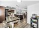Open kitchen with granite countertops, stainless steel appliances, and wood floors at 472 Sandy Hook Rd, Treasure Island, FL 33706