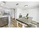 Open kitchen featuring light wood floors and easy access to the living room at 472 Sandy Hook Rd, Treasure Island, FL 33706