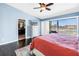 Spacious main bedroom with balcony access and waterfront views at 472 Sandy Hook Rd, Treasure Island, FL 33706