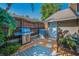 Private backyard with a barbecue grill, patio, and fencing for a cozy outdoor space at 508 N Mayo St, Crystal Beach, FL 34681