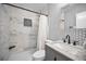 Newly renovated bathroom showcasing new tiling, walk-in shower, vanity with stylish fixtures, and modern design at 508 N Mayo St, Crystal Beach, FL 34681