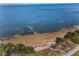 A scenic aerial view of a sandy beach, perfect for sunbathing and enjoying coastal living at 508 N Mayo St, Crystal Beach, FL 34681