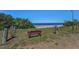 Convenient beach access with a bench, perfect for relaxing and enjoying the ocean views at 508 N Mayo St, Crystal Beach, FL 34681
