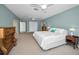 Large primary bedroom featuring ensuite bathroom, ceiling fan, and lots of storage at 508 N Mayo St, Crystal Beach, FL 34681