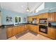 Kitchen with lots of counter space, wooden cabinets and stainless steel appliances at 508 N Mayo St, Crystal Beach, FL 34681