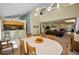 Open floor plan featuring a living room with a brick fireplace and dining area at 508 N Mayo St, Crystal Beach, FL 34681