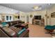 Open-concept living room featuring a cozy sofa and easy access to outdoor dining at 508 N Mayo St, Crystal Beach, FL 34681